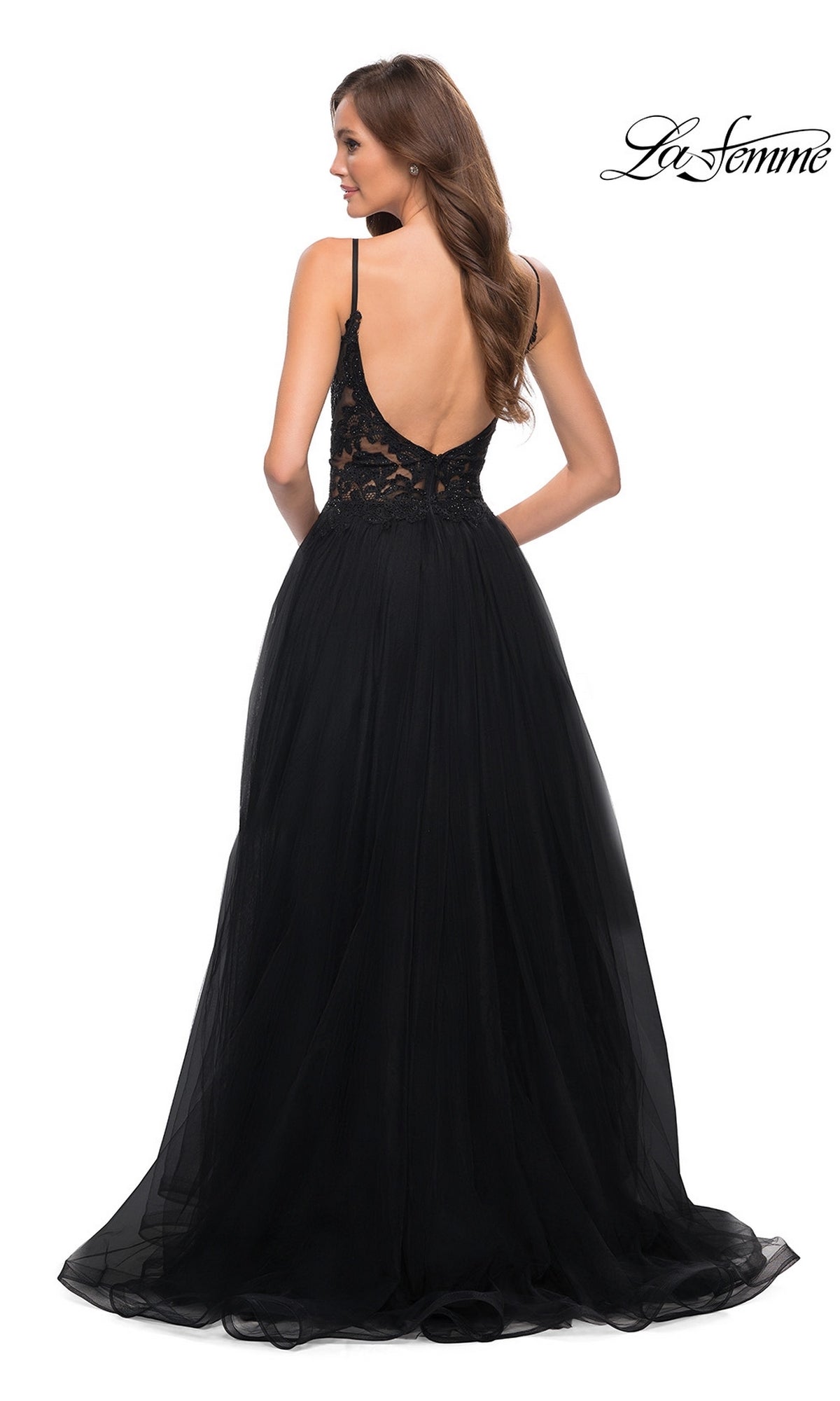 A woman stands facing away from the camera in the La Femme Lace-Bodice Long A-Line Prom Dress 29686, featuring an embroidered-lace bodice and low back. The